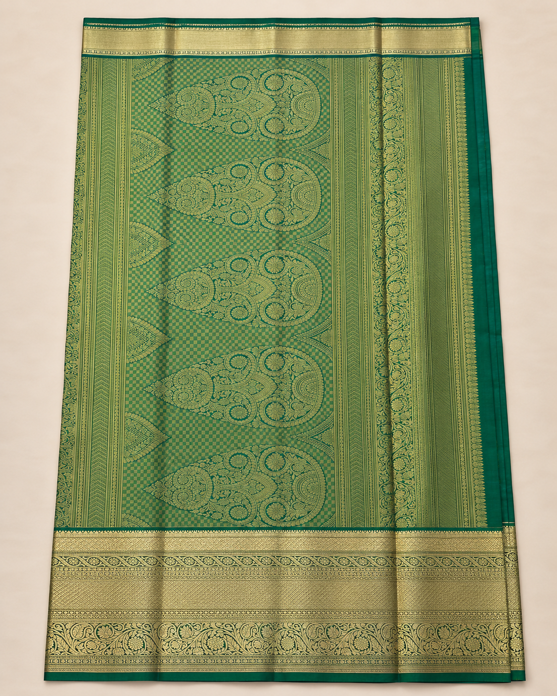 Green and gold saree pallu with a checked ground and five ornate elongated floral and paisley motifs.