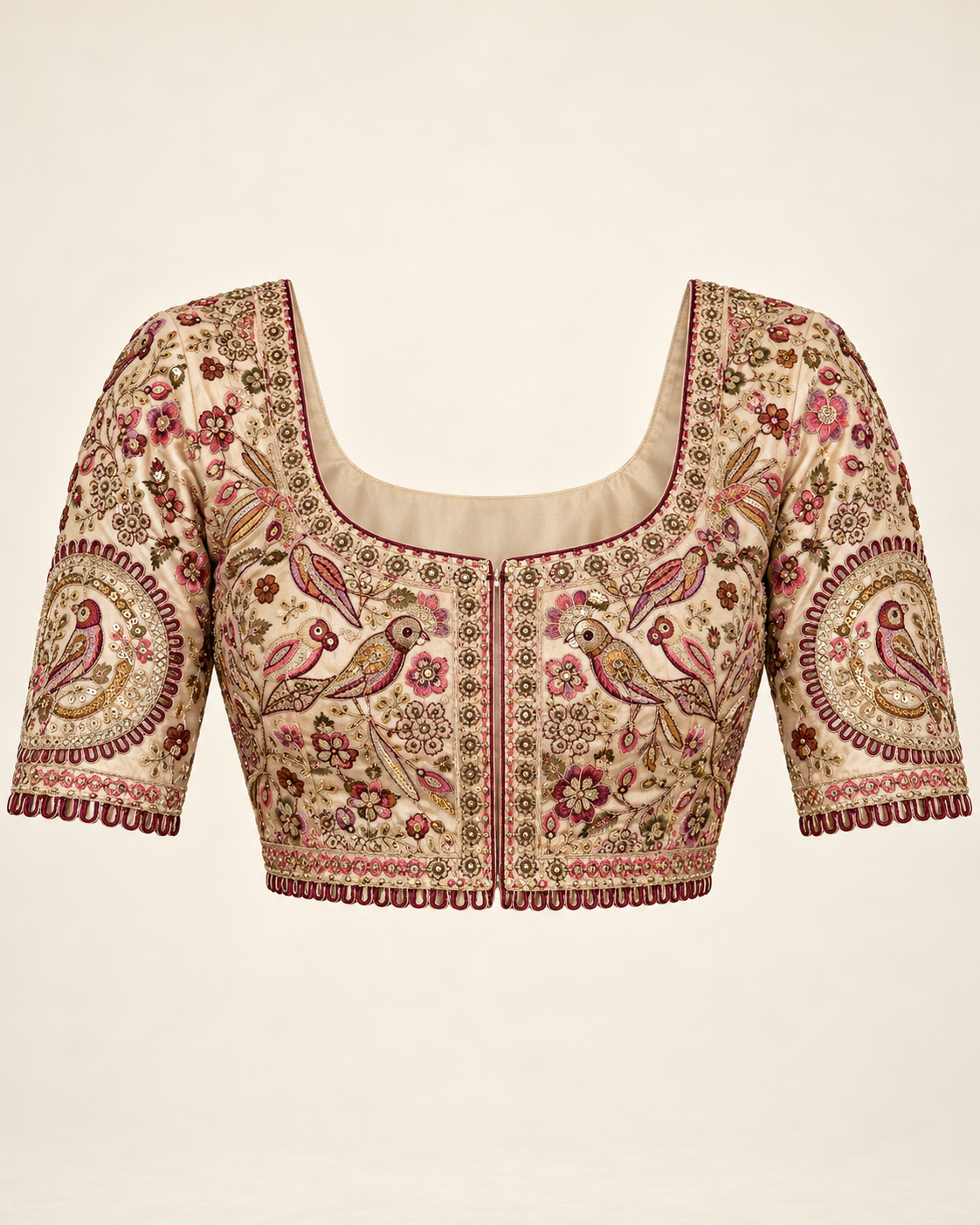 Stitched cream blouse with bird and floral embroidery, elbow-length sleeves and loop edging