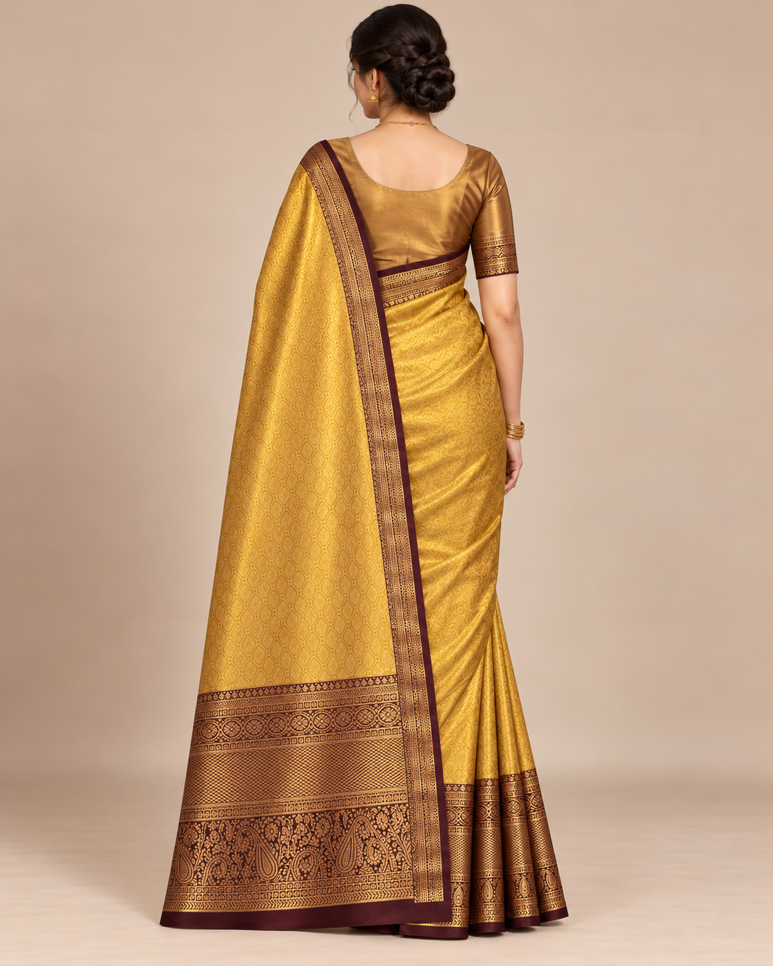 Back view of golden silk saree and patterned pallu