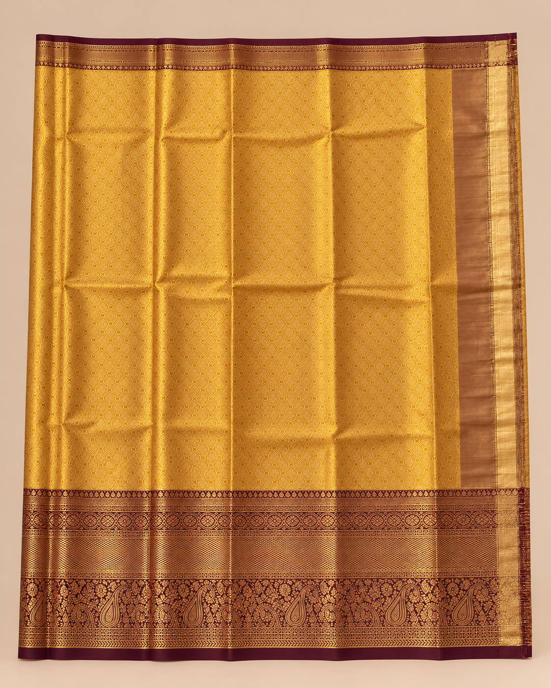 Golden patterned pallu with burgundy and gold woven border