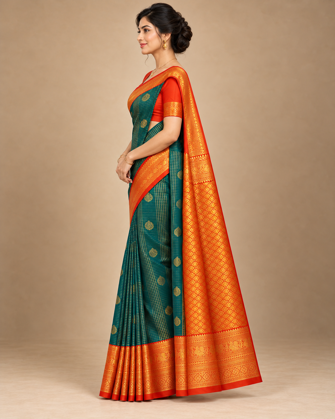 Side view of teal silk saree and orange patterned pallu