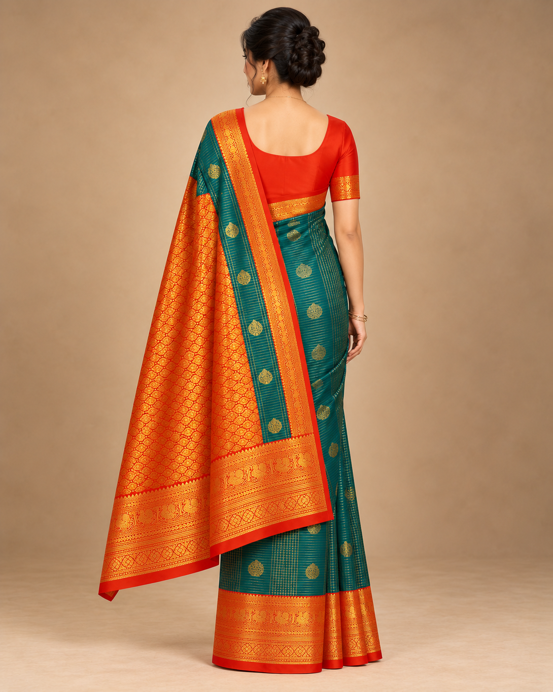 Back view of teal silk saree with orange and gold pallu
