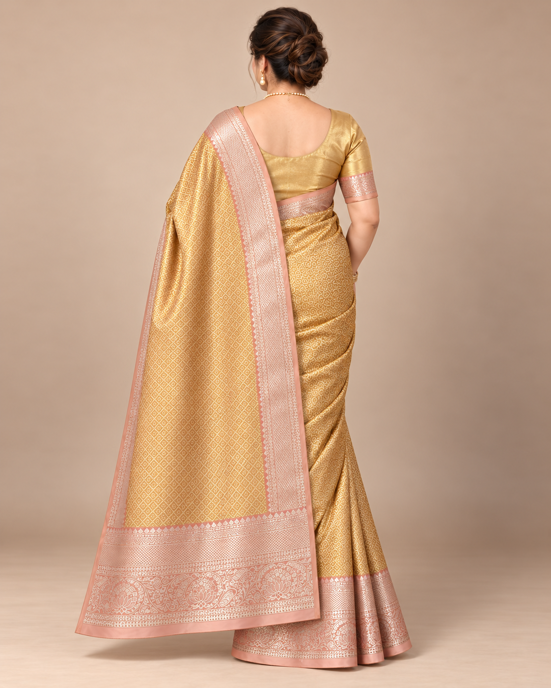 Back view showing the gold diamond-patterned pallu