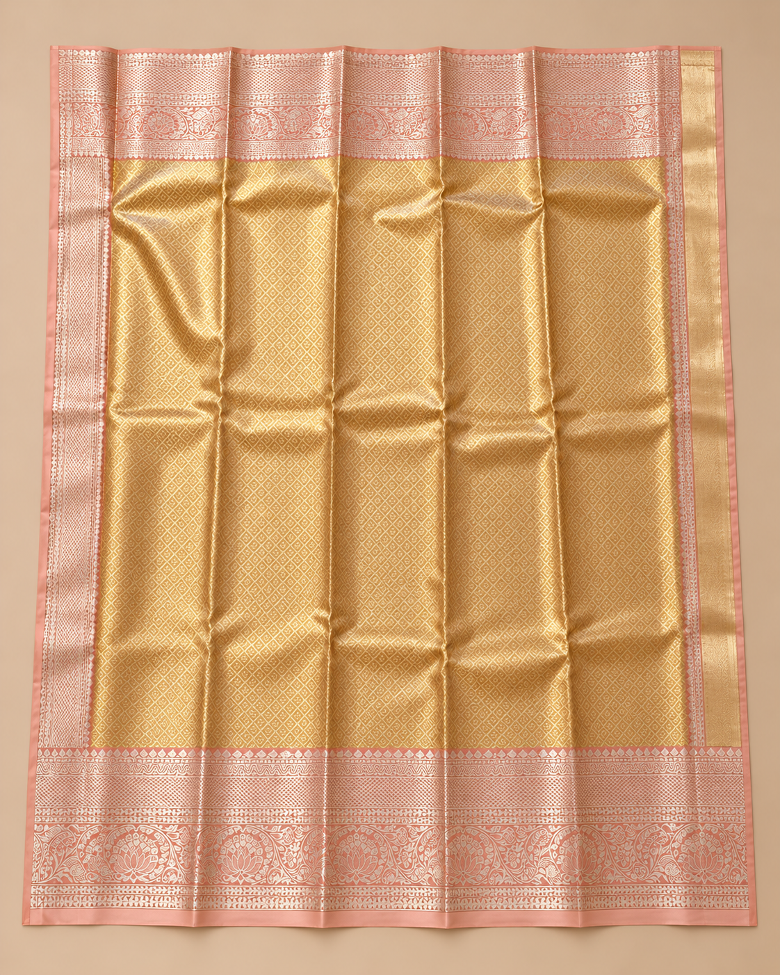 Gold diamond-patterned pallu with blush metallic borders