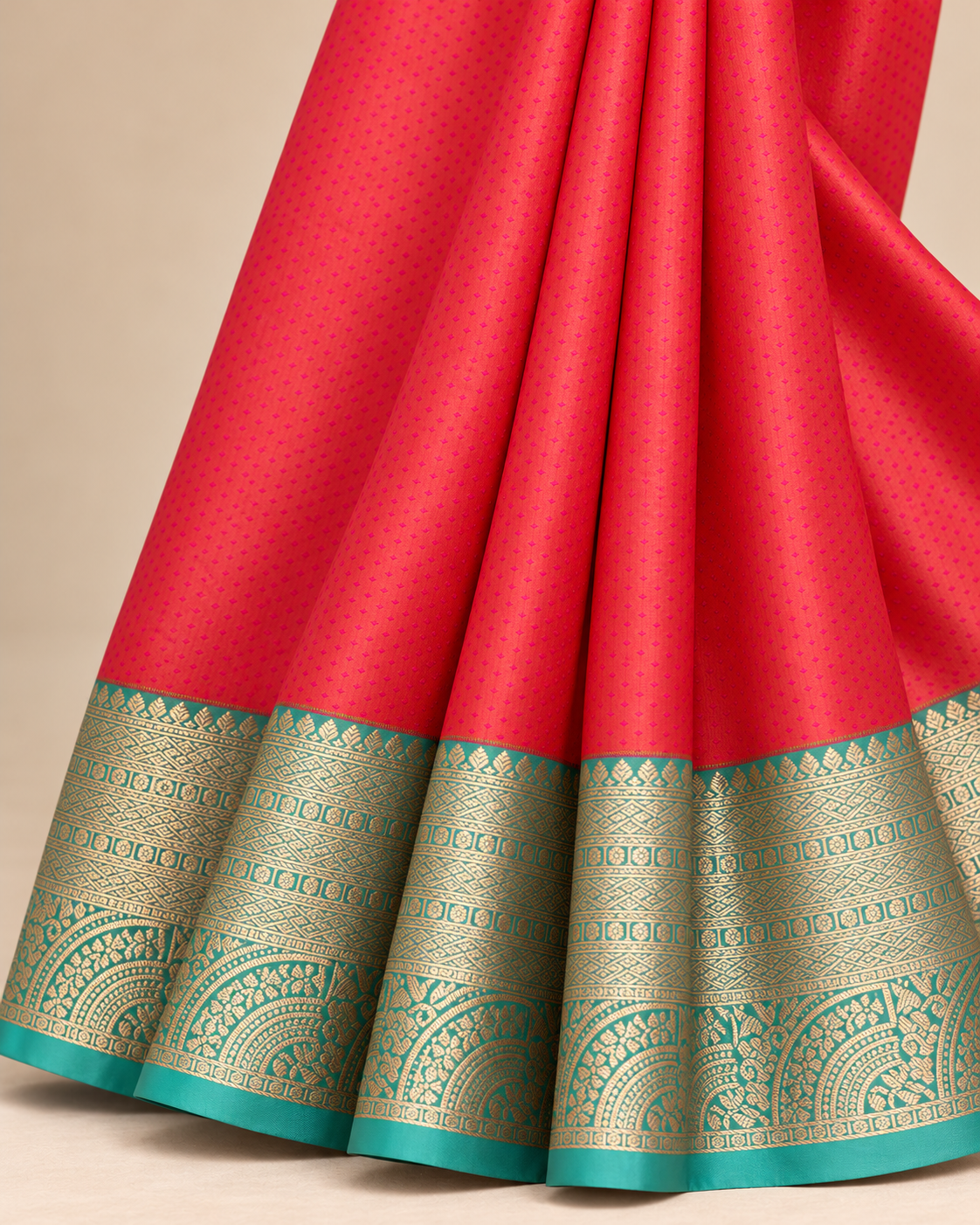 Close-up of coral silk and turquoise woven border