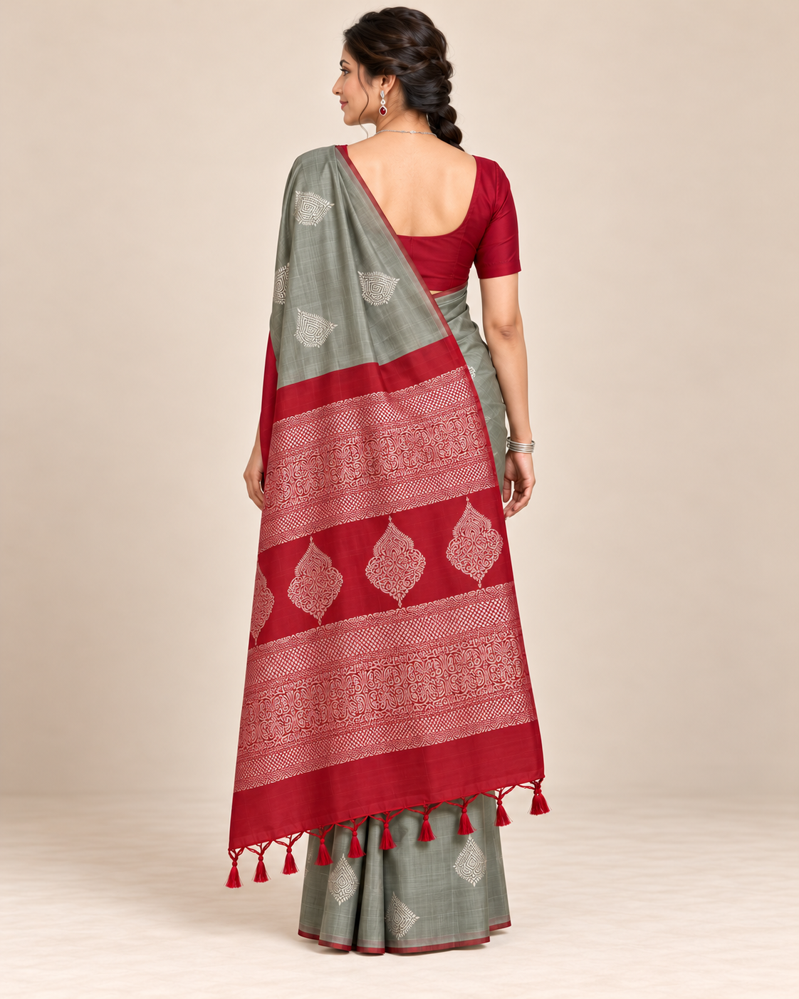 Back view showing red pallu with silver woven details