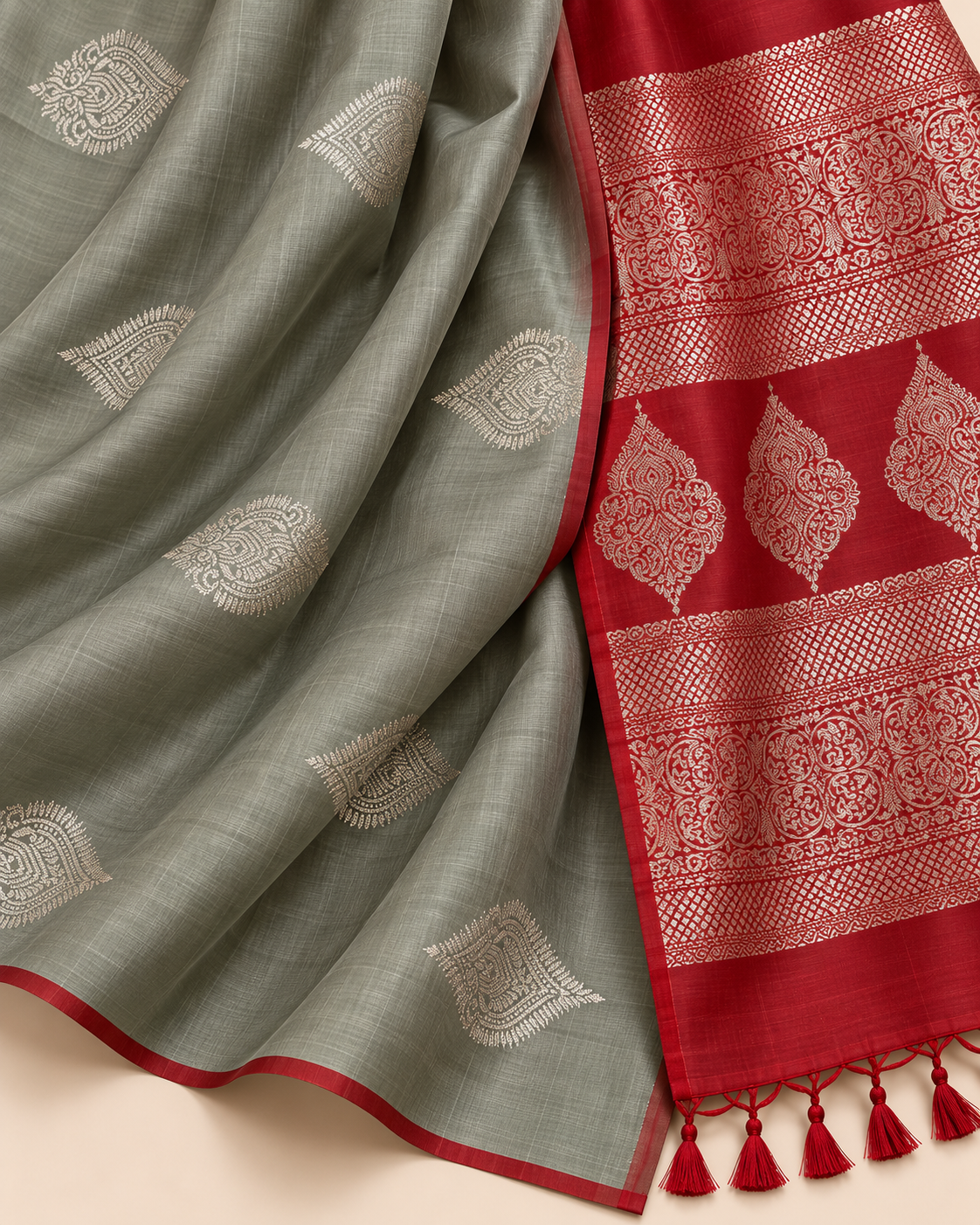 Close-up of silver leaf motifs on sage grey silk