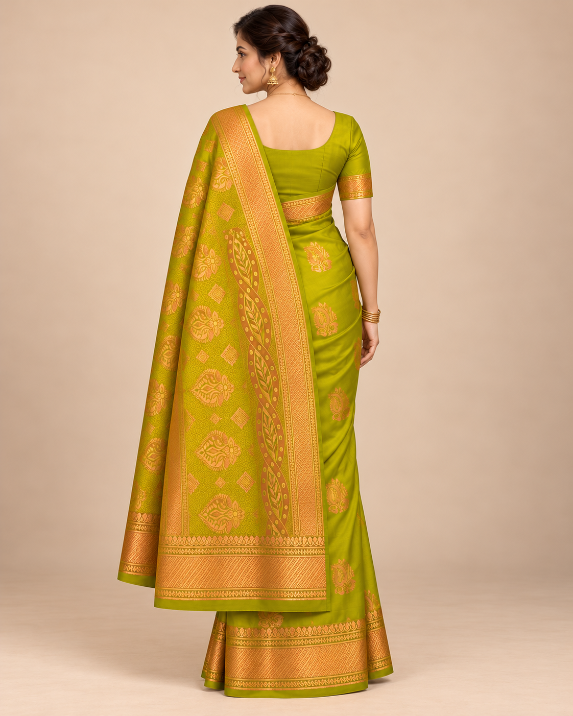 Chartreuse silk saree with gold paisley motifs — back view