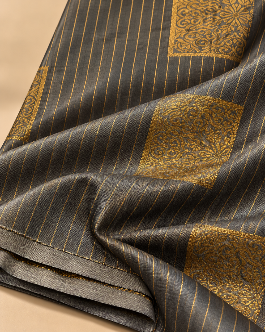 Gold square motif and pinstripe detail — charcoal grey borderless silk saree