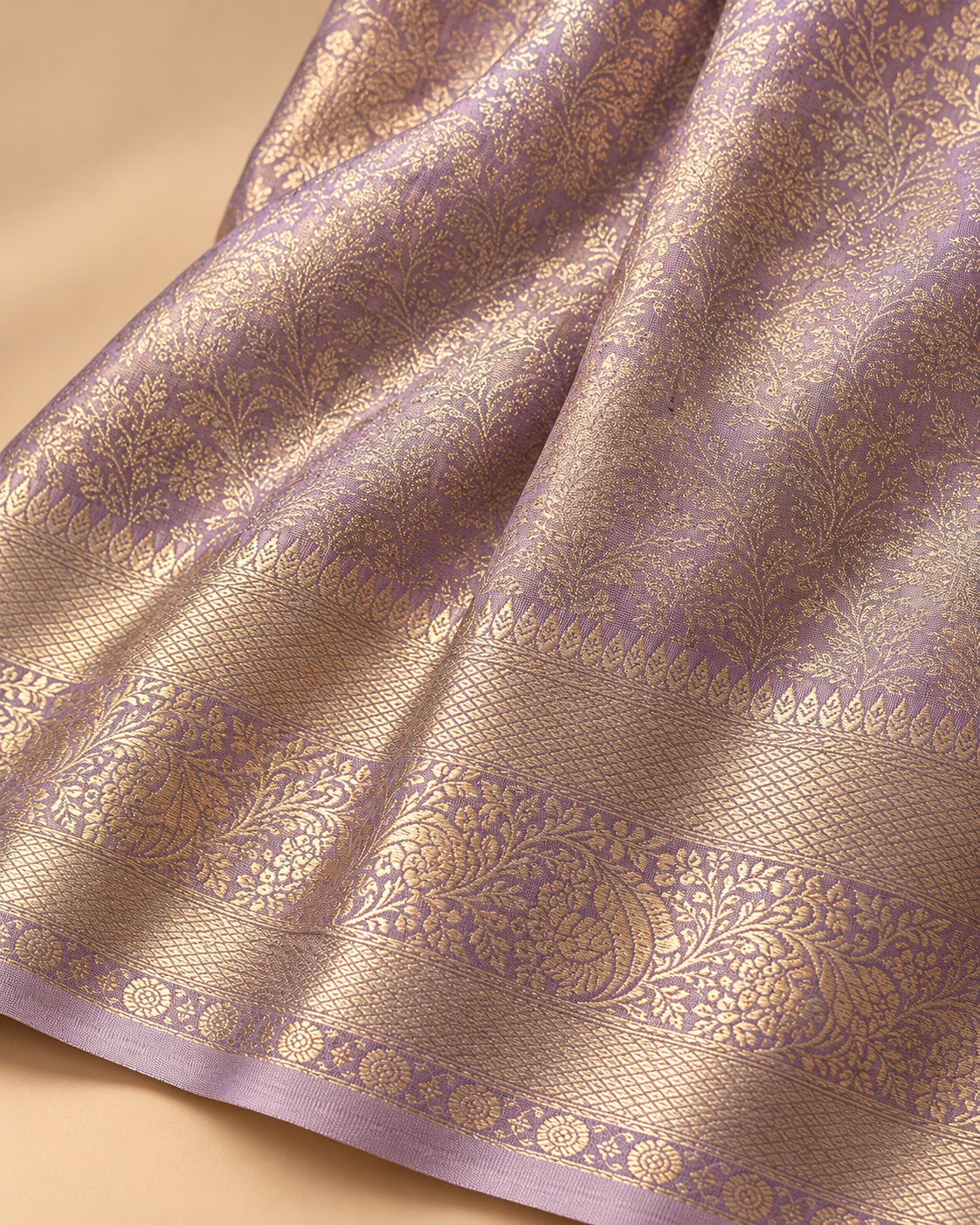 Metallic floral weave and border detail — lavender silk saree