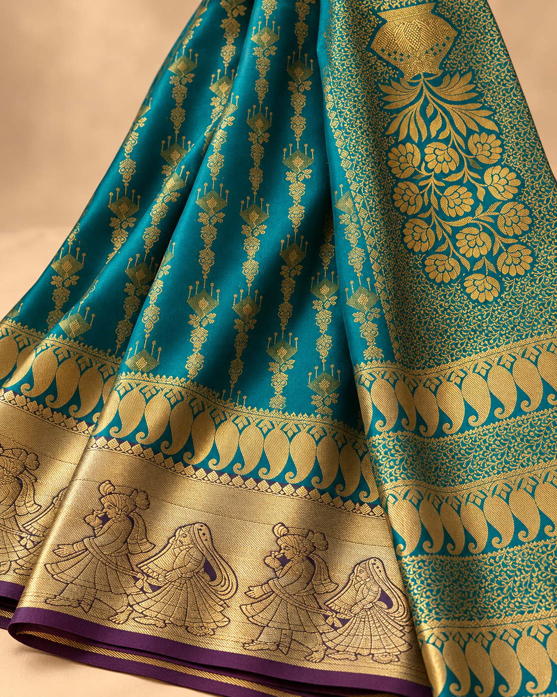 Woven motifs and border detail — peacock teal silk saree with pink floral pallu