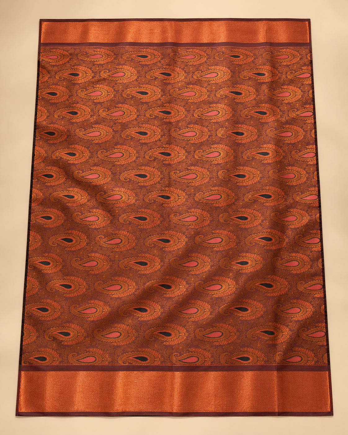 Rust and copper paisley pallu — charcoal silk saree