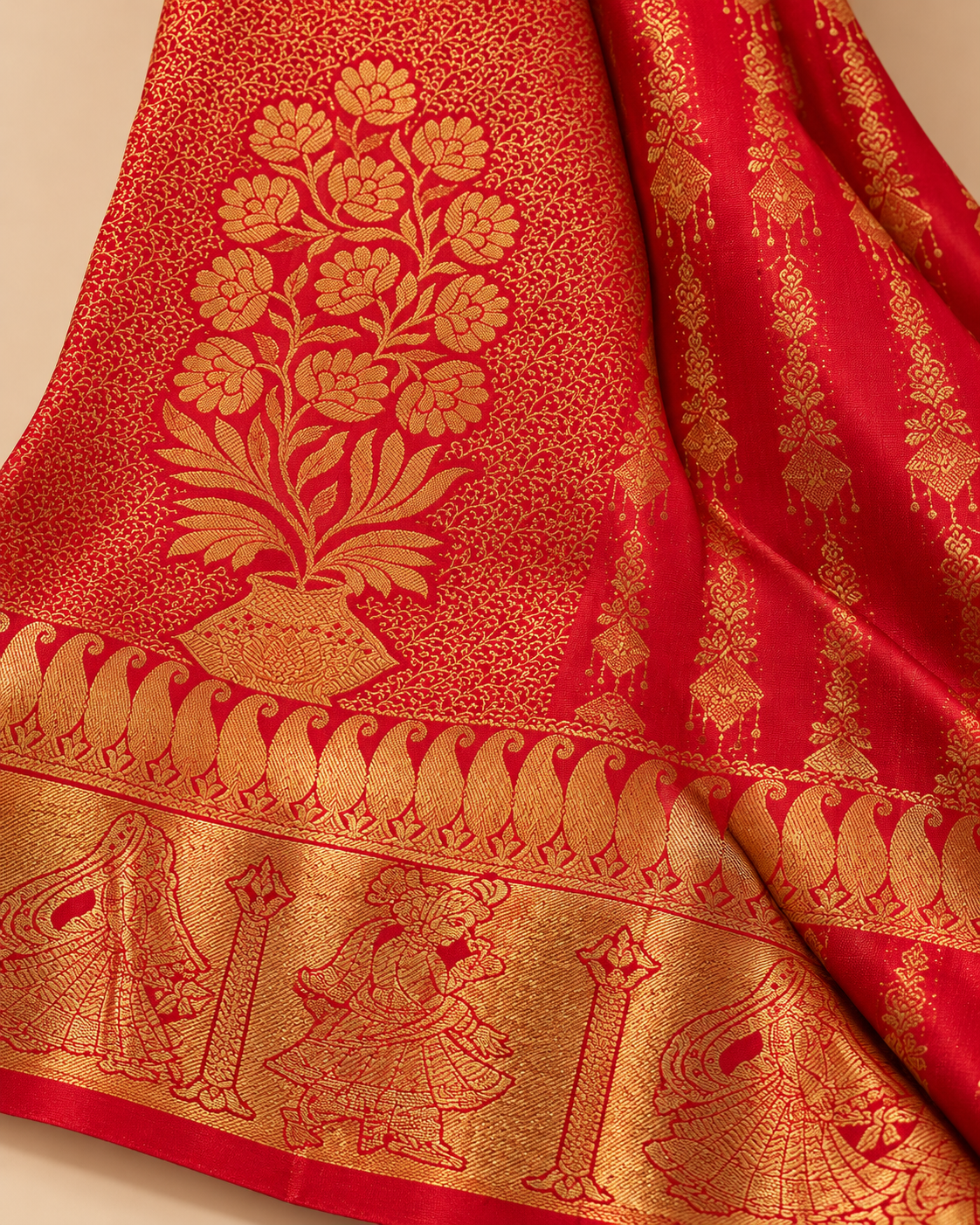 Woven motifs and border detail — red and gold floral panel silk saree