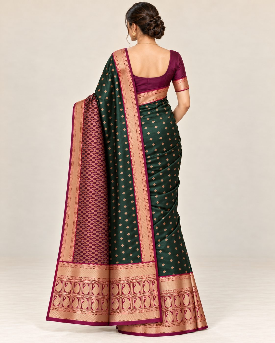 Rear view of a forest green silk saree and patterned pallu