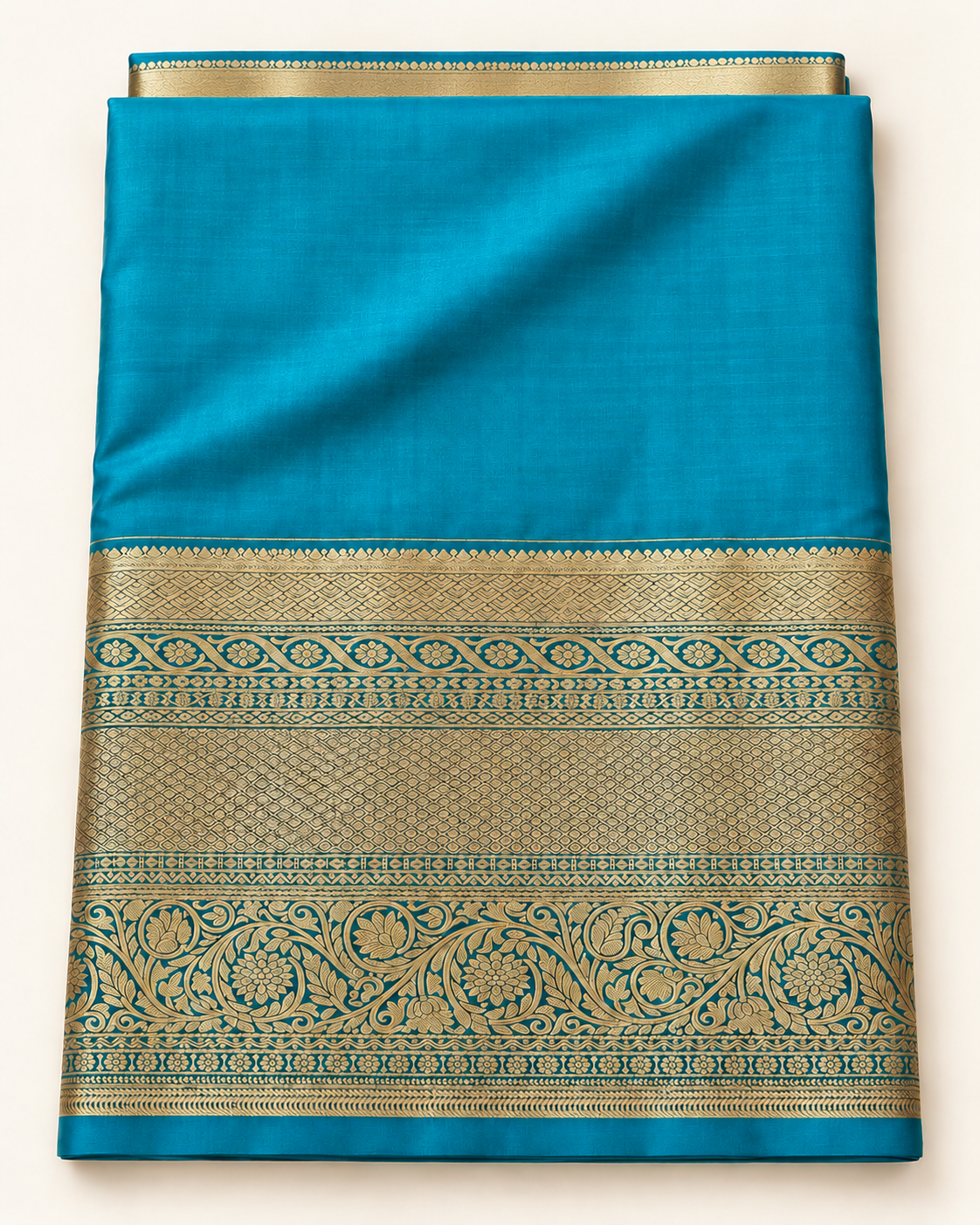 Included lighter blue-turquoise unstitched blouse fabric with gold border