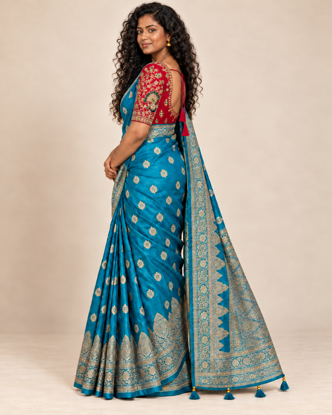 Side view of turquoise saree with red embroidered blouse