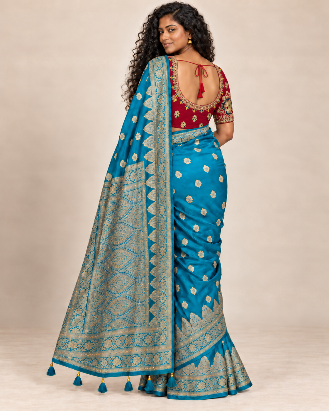 Back view of red blouse and turquoise saree pallu